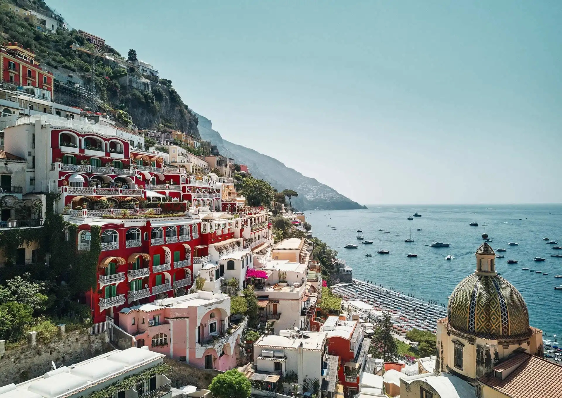 Stunning coastal villa terrace overlooking the Mediterranean Sea with loungers and Mediterranean architecture, Amalfi Coast luxury accommodation
